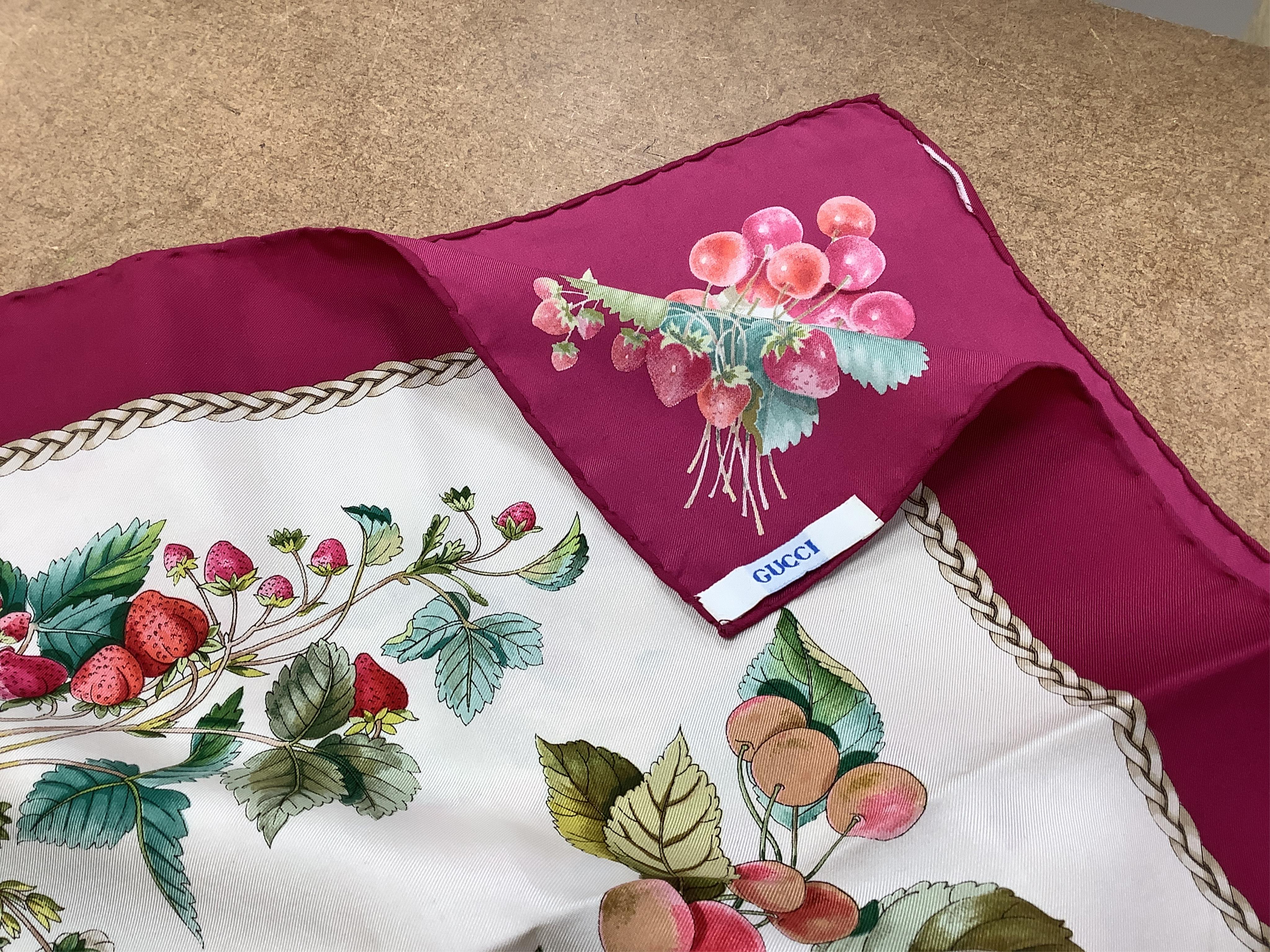 A vintage Gucci silk scarf with a design of strawberries and cherries, 86 x 87cm